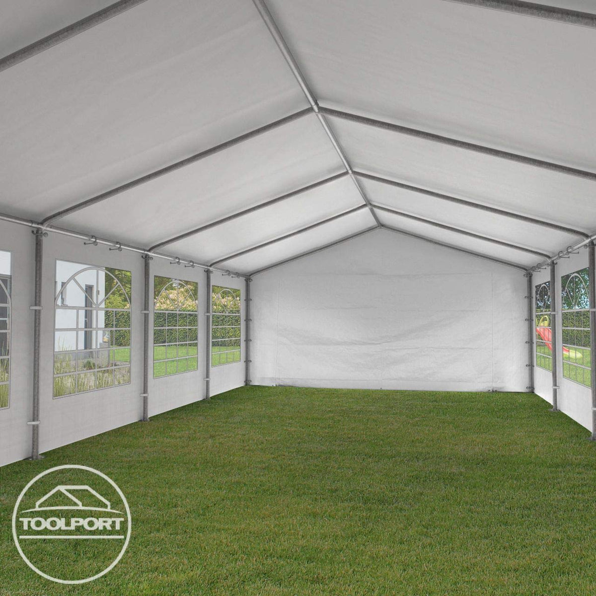 Interior view of the marquee showing galvanized roof beams, side windows and grass floor