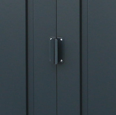 Head-on view of the shed showing closed double sliding doors, white trim and the raised entry threshold