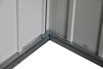 Close-up of a dark metal handle mounted on the sliding shed door