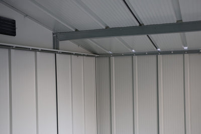 Interior view of the roof showing steel rafters, ribbed metal panels and upper gable vents