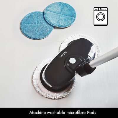 Top view of PowerGlide with two spare blue machine‑washable microfiber pads placed nearby
